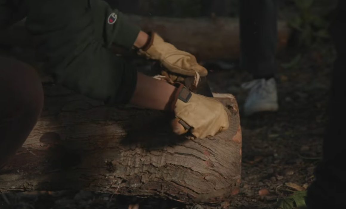 NEEF/SCA National Public Lands Day Promo Video Screenshot of Hands Sawing Log